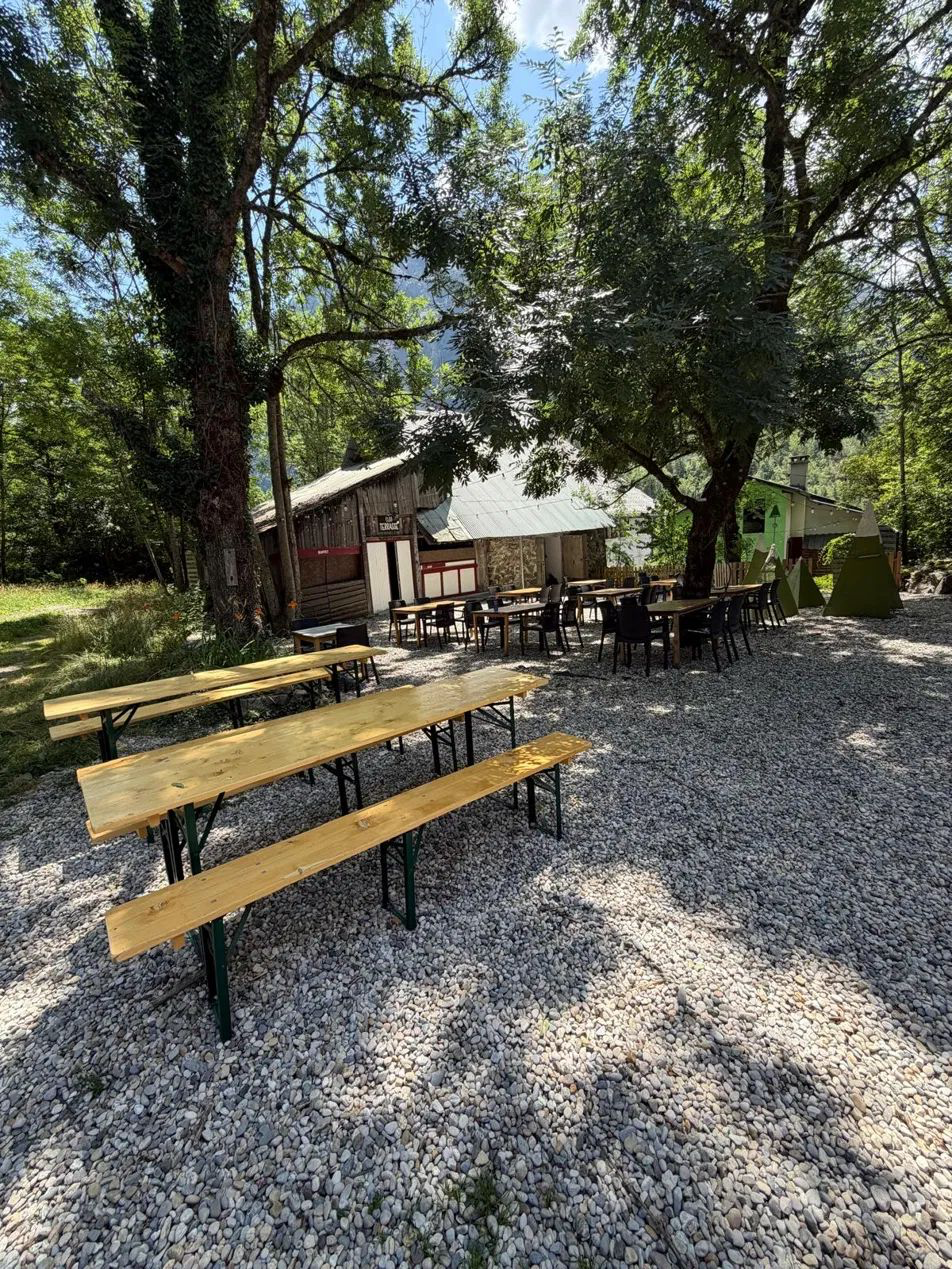 Wooden trestle tables and benches set up at an outdoor venue in Scotland
